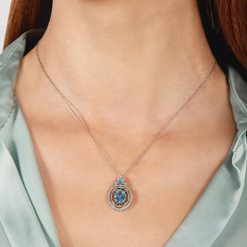 enchanted_disney-jasmine_fine_jewelry_9k_white_gold_and_yellow_gold_with_0_20_cttw_diamonds_and_swiss_blue_topaz_aladdin_cave_of_wonders_pendant_necklace_0.20CTTW_2